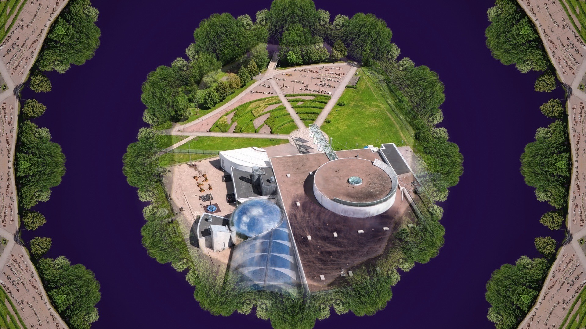 Aerial Heureka Gaussian splat kept intact in the centre while a kaleidoscope mirrors the surroundings
