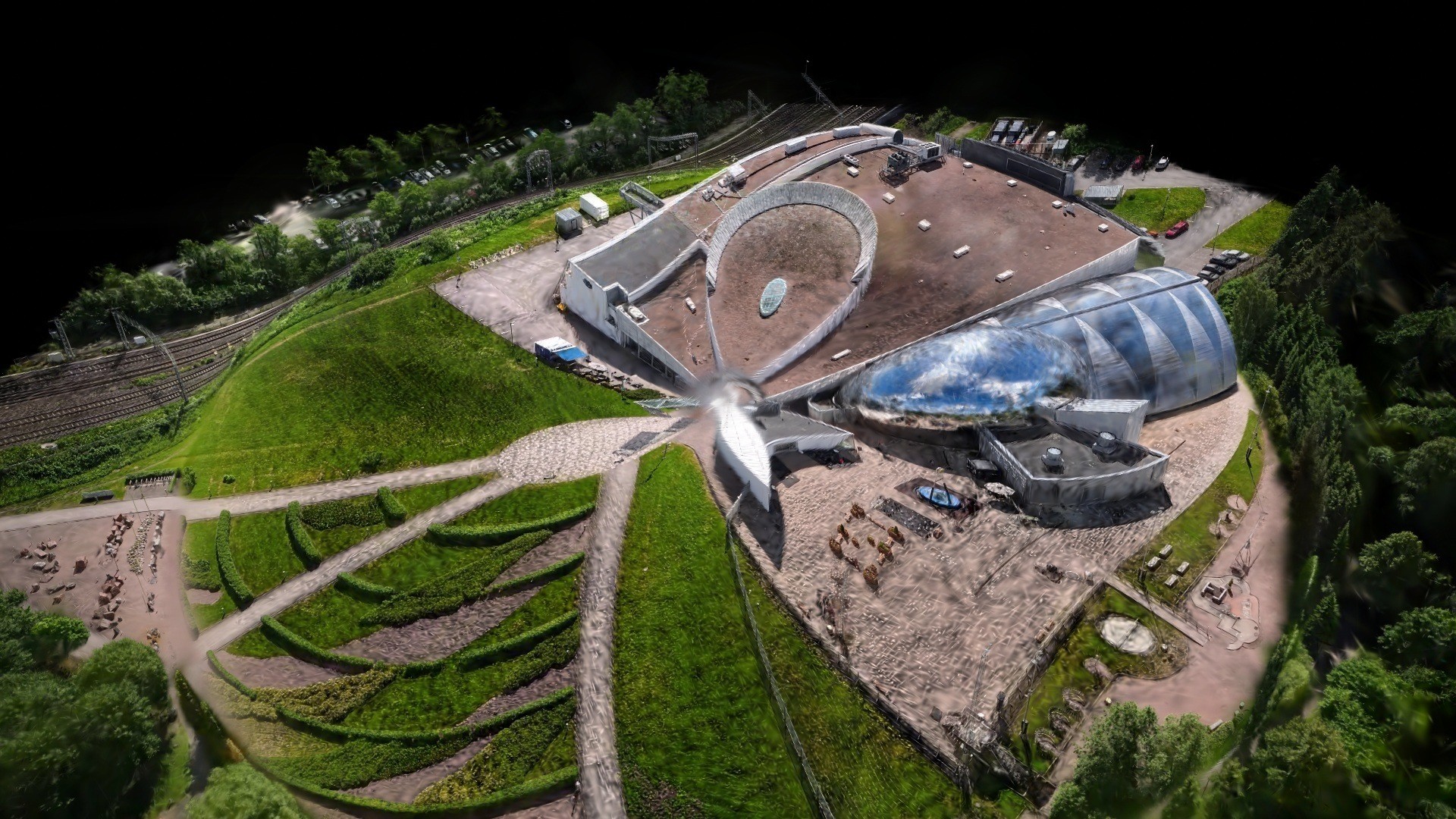 Radial ripple effect on an aerial Gaussian splat of the Heureka science centre