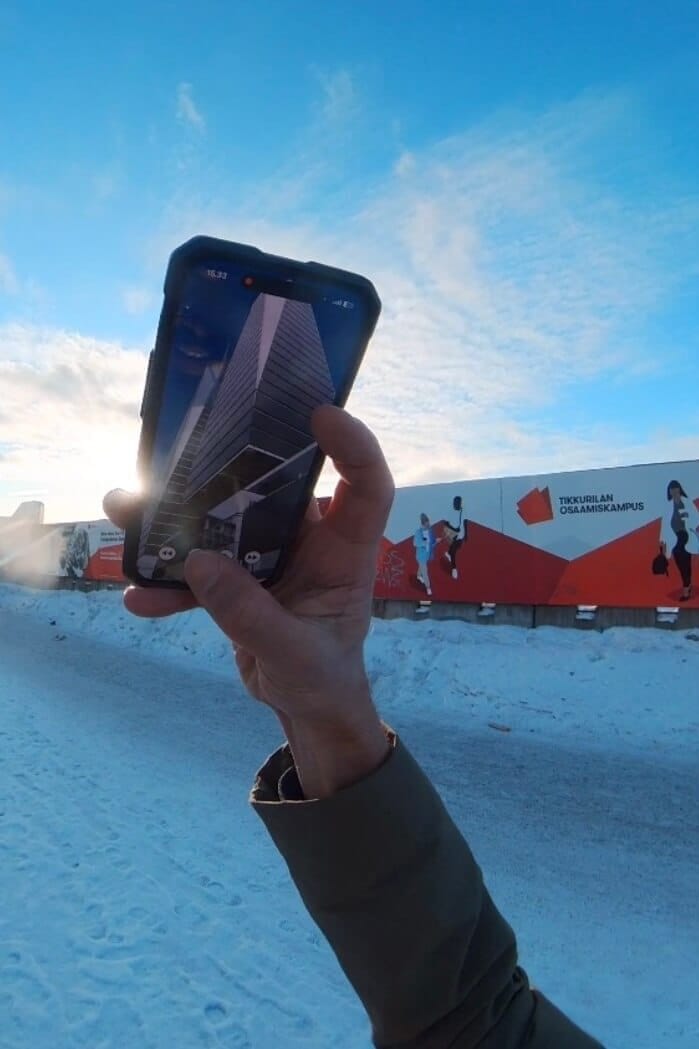 Smartphone showing 1:1 real scale construction project in augmented reality